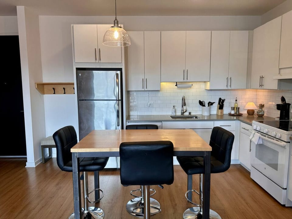 A fully-equipped kitchen with an island and bar stool seating—everything you need to prep, cook, and refuel