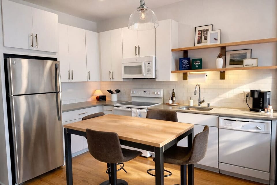 A fully-equipped kitchen with an island and bar stool seating—everything you need to prep, cook, and refuel