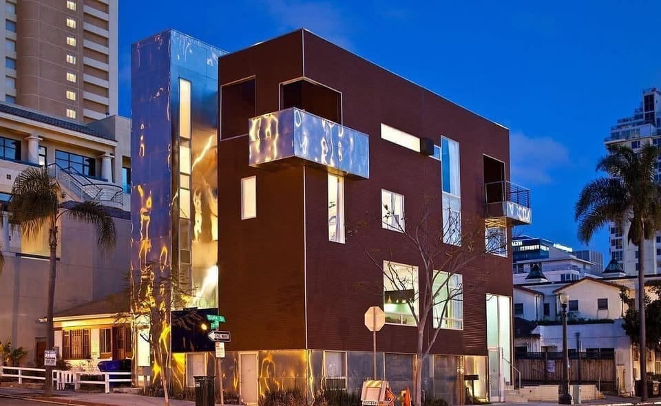 Contemporary exterior with bold architecture and evening lighting