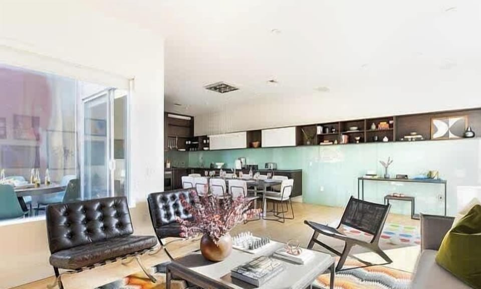 Expansive living area with comfortable seating and city views
