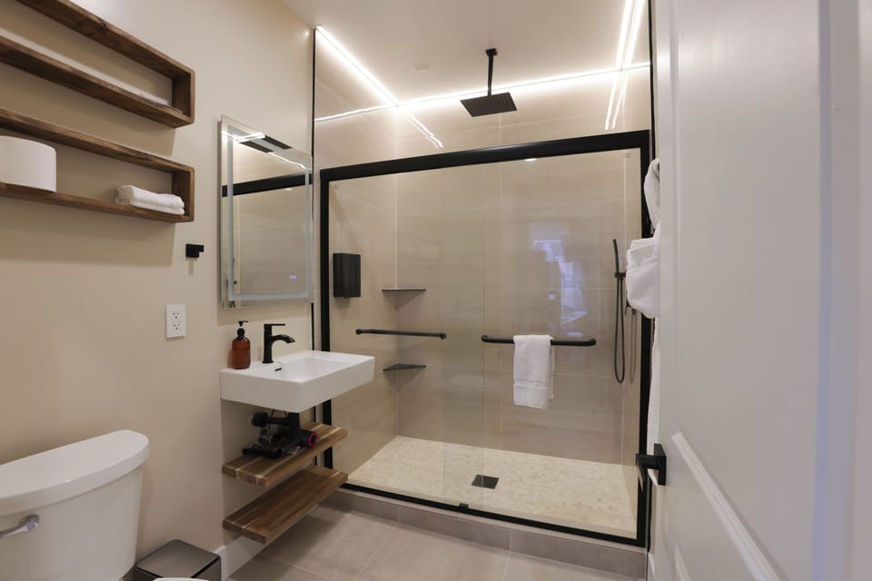 Clean modern bathroom with walk-in shower, hot water & fresh towels at Dupont 

