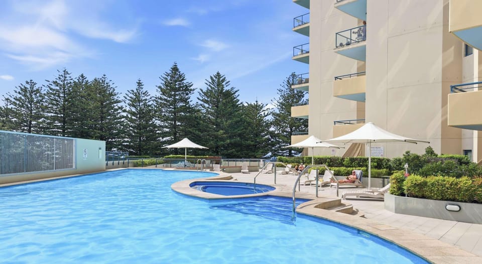 Outdoor swimming pool with lounge area