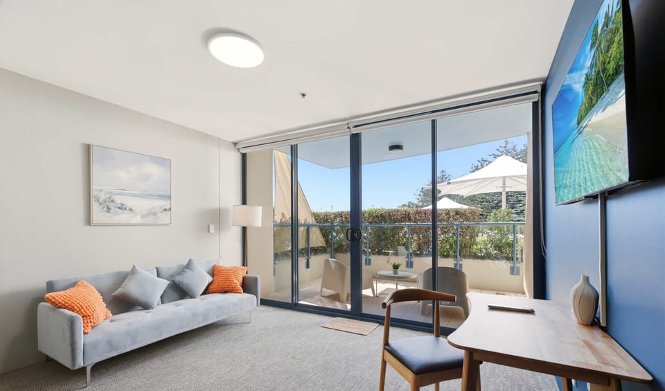 Living area with balcony and city view