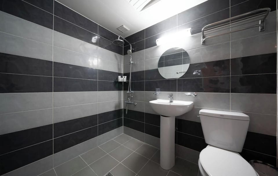 Twin Room | Bathroom | Hair dryer, slippers, towels, soap