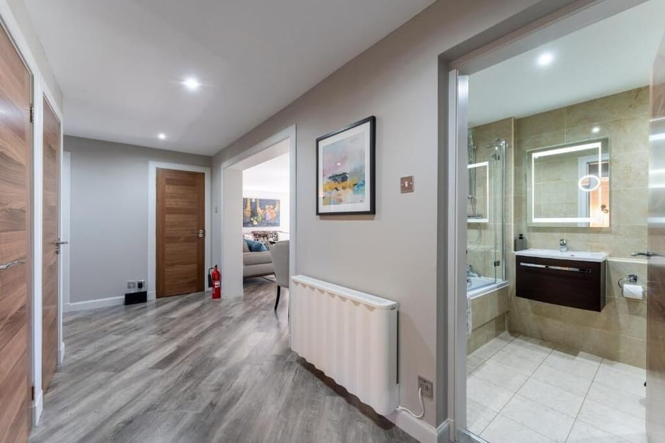 Preview the layout from entry to lounge and bath area.