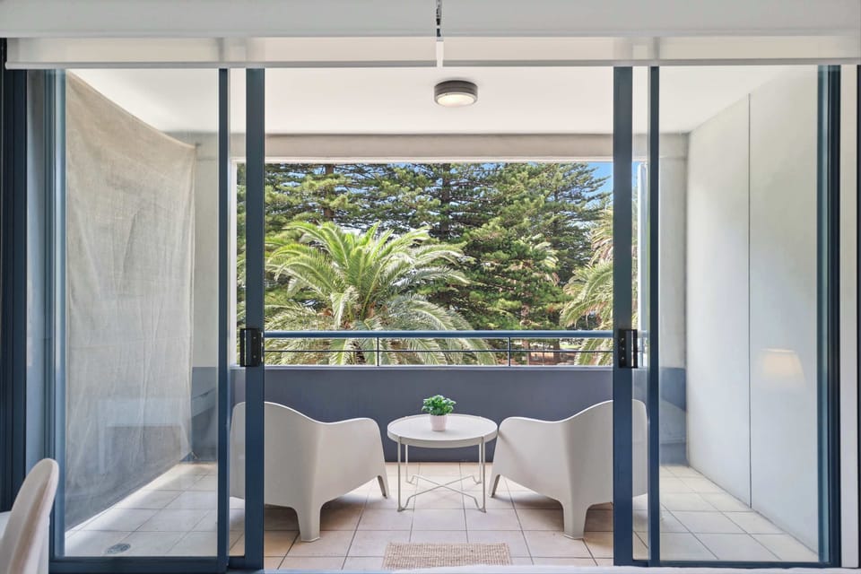 Balcony with seating and greenery view