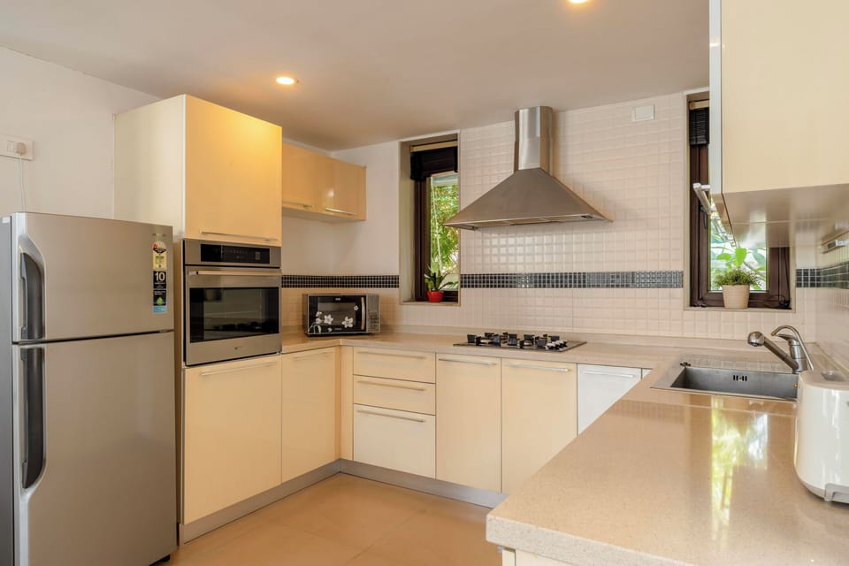 Villa, 3 Bedrooms, Pool View, Beachside | Private kitchen | Electric kettle, dining tables