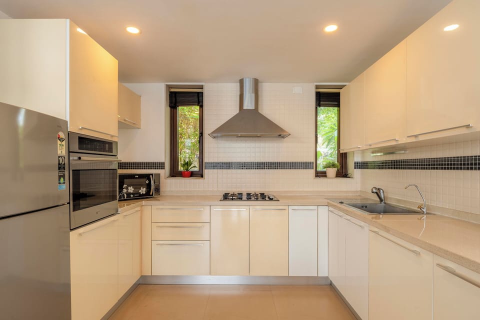 Villa, 3 Bedrooms, Pool View, Beachside | Private kitchen | Electric kettle, dining tables