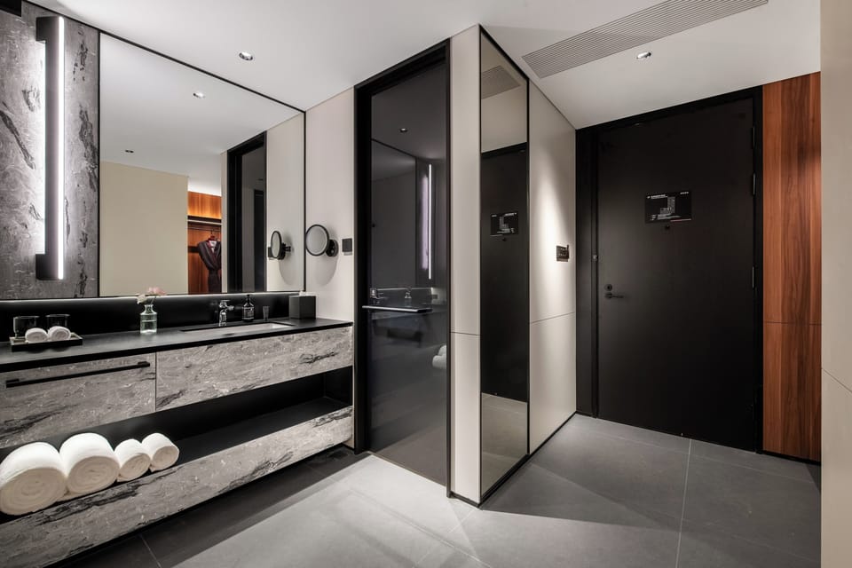 Designer toiletries, hair dryer, bathrobes, slippers