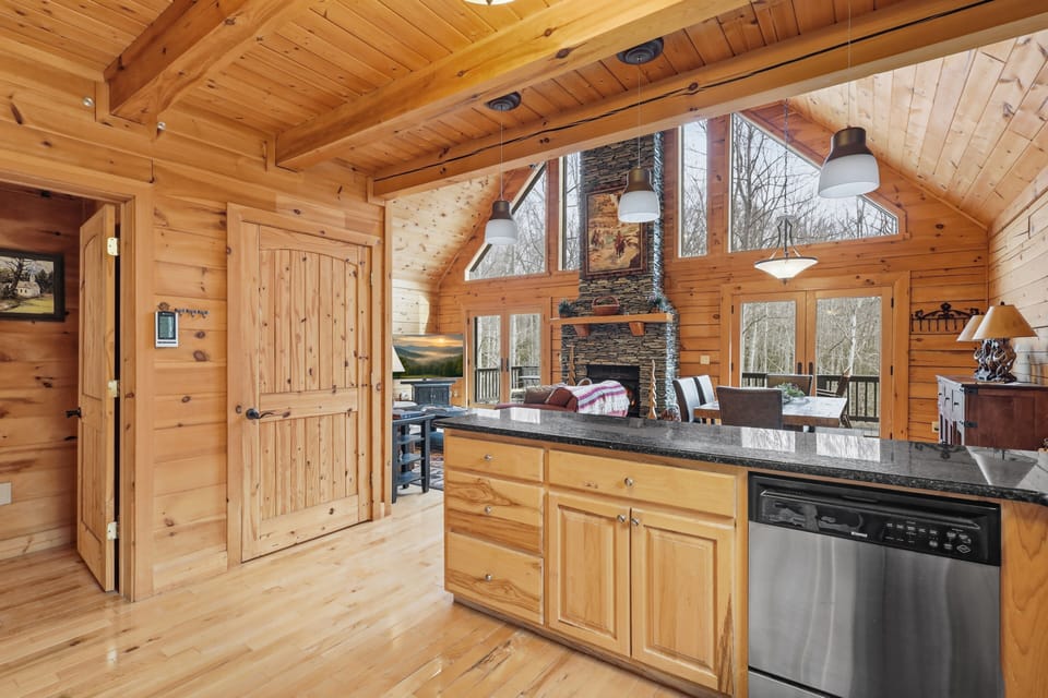 Kitchen bar with granite counter overlooking the open living area