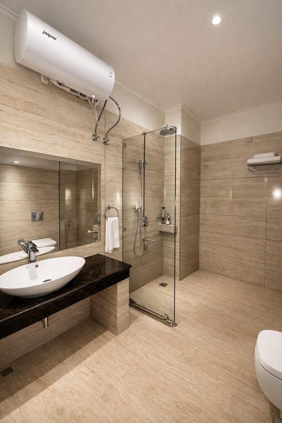 Luxury Studio | Bathroom | Shower, rainfall showerhead, hair dryer, towels