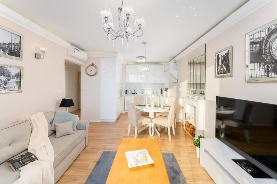 Deluxe Apartment, Balcony | Living area | Flat-screen TV