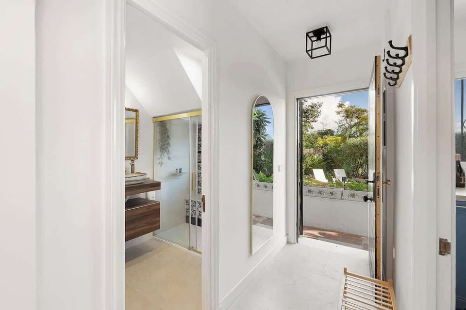 This is the entrance hall, featuring a full-length mirror and shoe rack for your convenience.