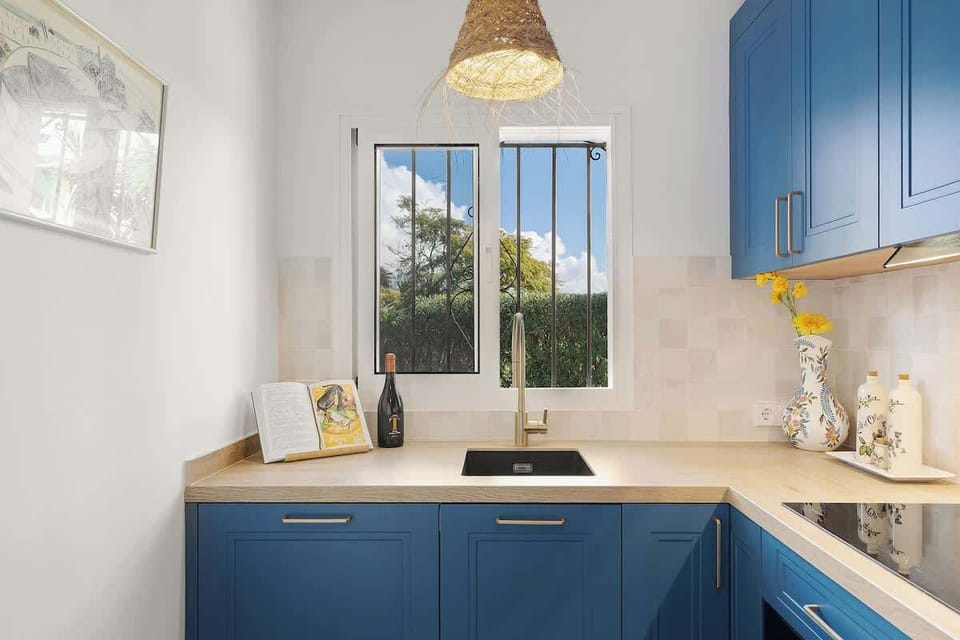 The kitchen includes a hidden dishwasher and offers lovely garden and mountain views from the window.