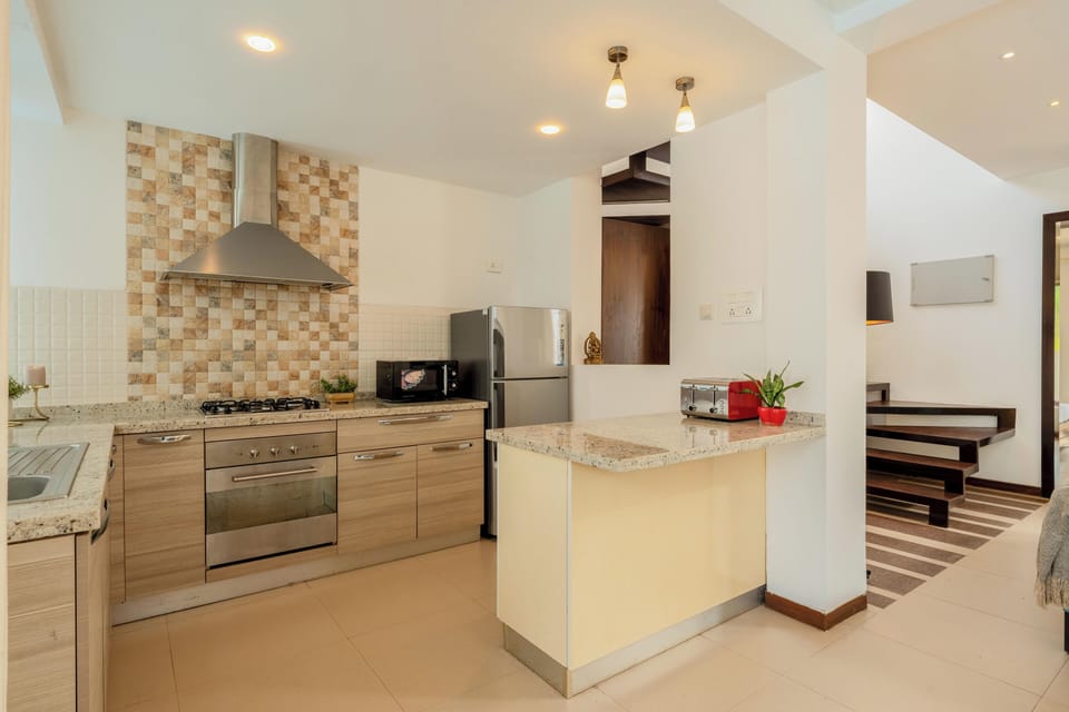 Villa, 3 Bedrooms, Pool View, Beachside | Private kitchen | Electric kettle, dining tables