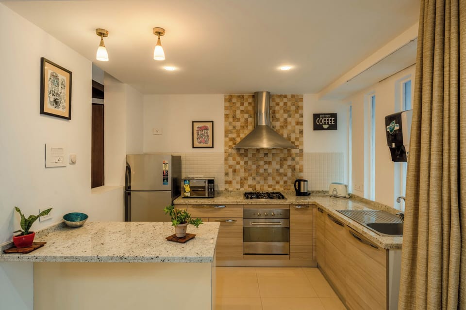Villa, 3 Bedrooms, Pool View, Beachside | Private kitchen | Electric kettle, dining tables