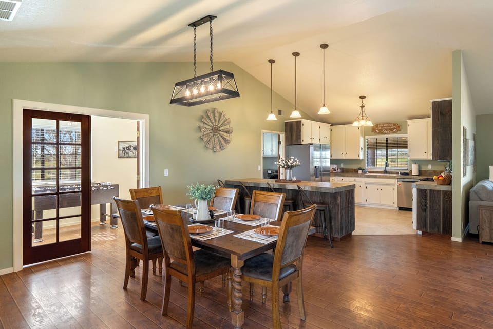 Dining table set beside the bright kitchen