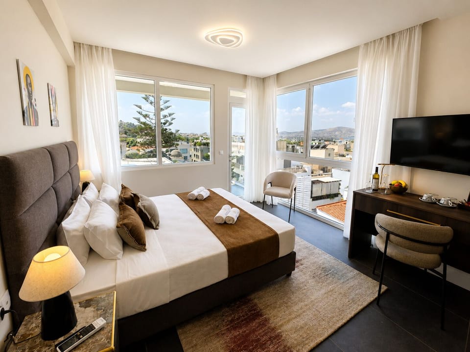 Deluxe Room with Balcony & Hot Tub | In-room safe, blackout drapes, iron/ironing board (on request)