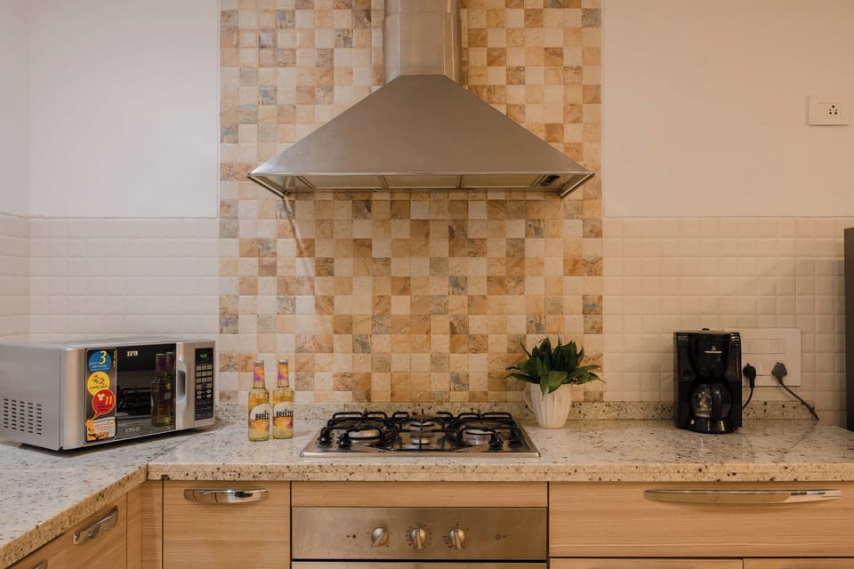 Villa, 3 Bedrooms, Pool View, Beachside | Private kitchen | Electric kettle, dining tables