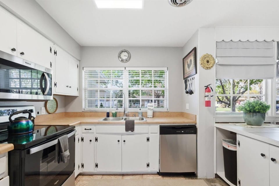 Open kitchen layout keeps everyone connected while cooking.
