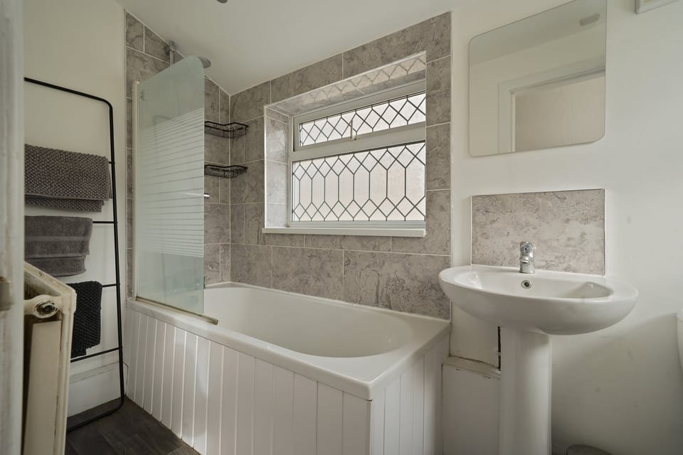 Bathroom with shower over the bath