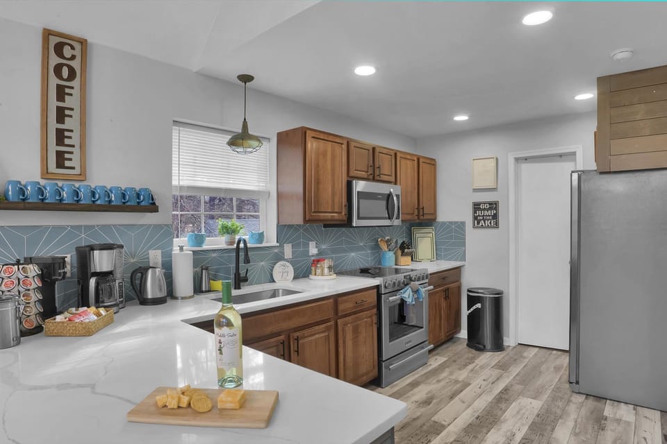 Full kitchen ready for home-cooked meals with stainless steel appliances

