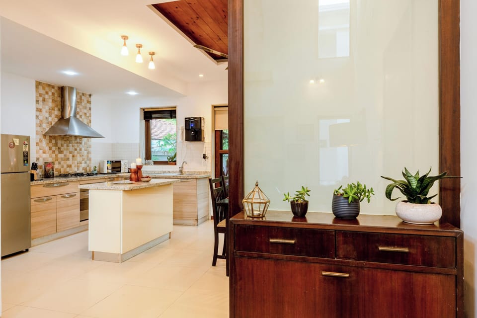 Villa, 3 Bedrooms, Pool View, Beachside | Private kitchen | Electric kettle, dining tables