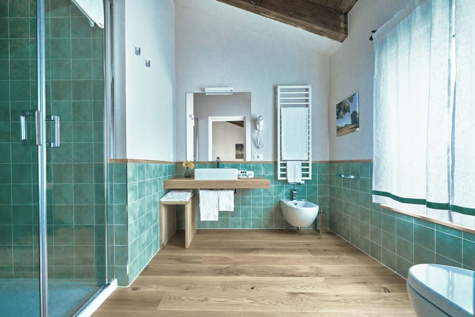 Superior Triple Room, Golf View | Bathroom | Shower, free toiletries, hair dryer, towels