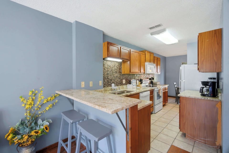 Charming kitchen awaits. And, whip up delicious meals in this inviting space with modern amenities!