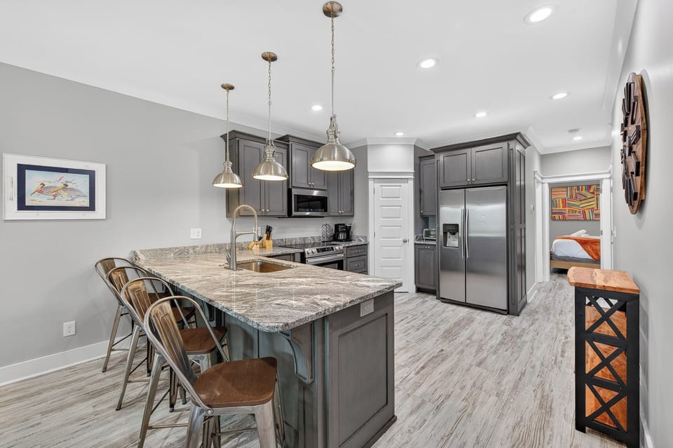 This home comes with two kitchens, two stoves, two fridges