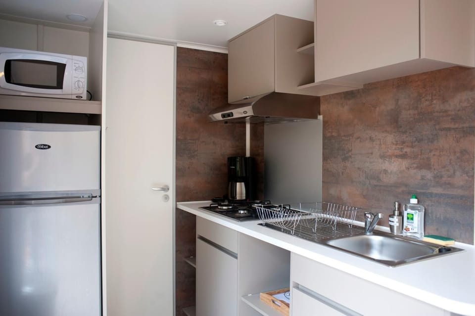 Fridge, microwave, stovetop, cookware/dishes/utensils