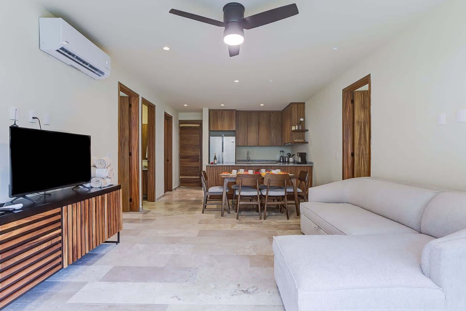 Living room w/ TV console, comfy seating & open layout for relaxing