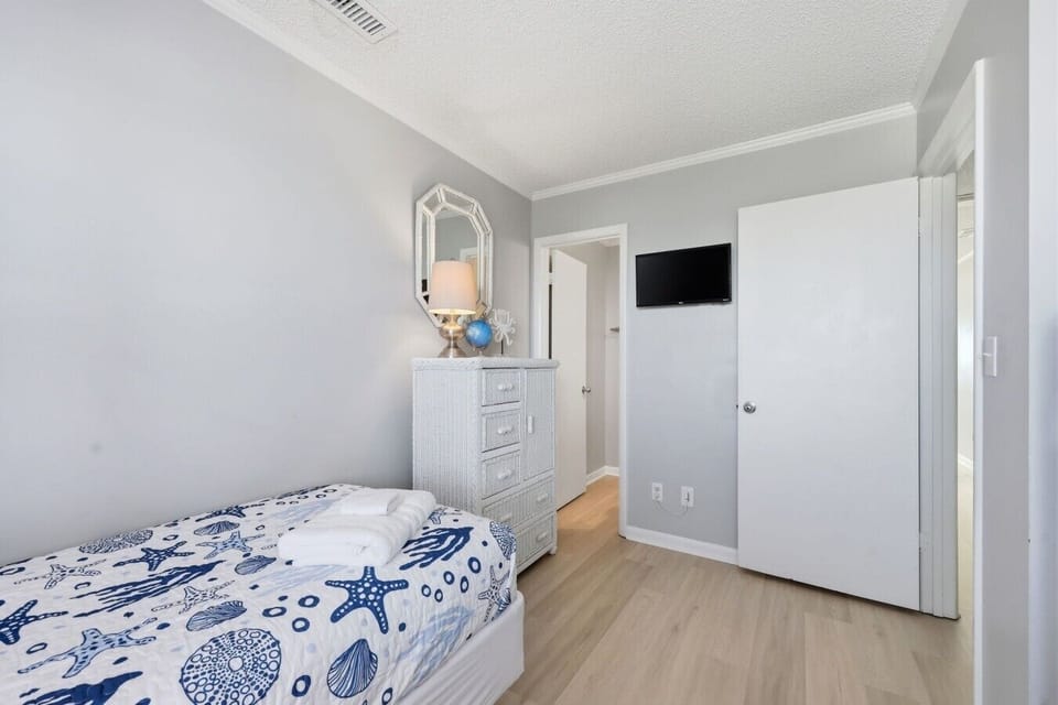 The bunk room also features a TV, making it a great space for kids and extra guests to relax and unwind