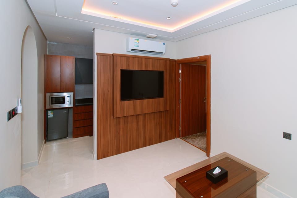 Junior Suite, City View | In-room safe, desk, laptop workspace, blackout drapes