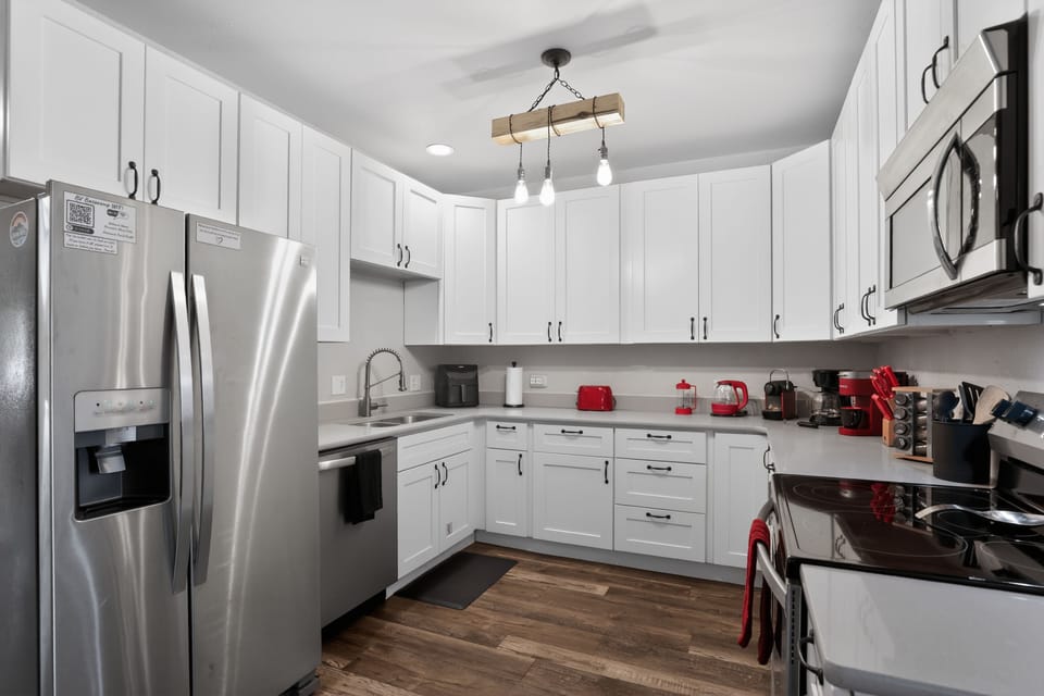 Bright modern kitchen with stainless appliances and plenty of prep space