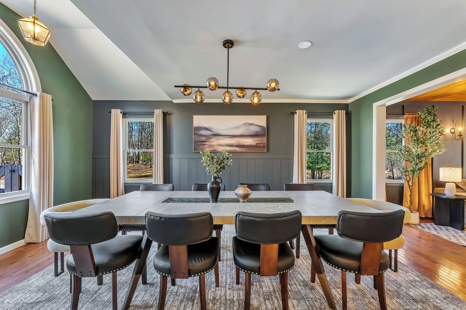 Spacious, modern dining hall and large windows with forest views.