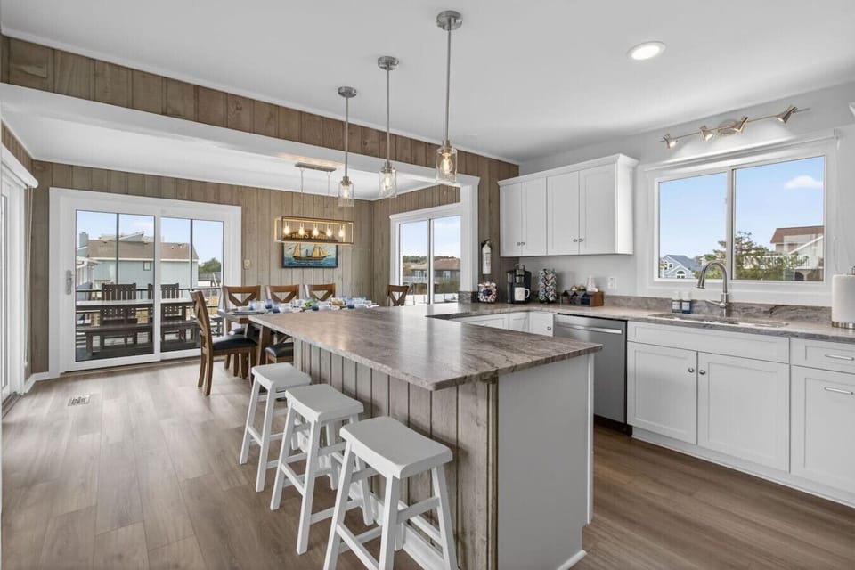 Open kitchen and dining area designed for group entertaining.