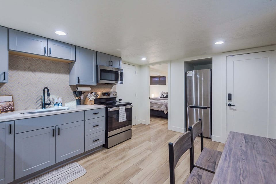 Stainless range, over-the-range microwave, and ample counter space. Serious cooking made easy.