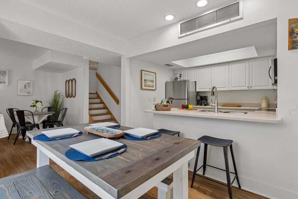 Open layout connecting kitchen, dining, and living spaces