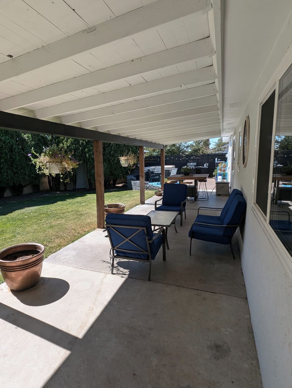 Back yard with a large covered porch. 