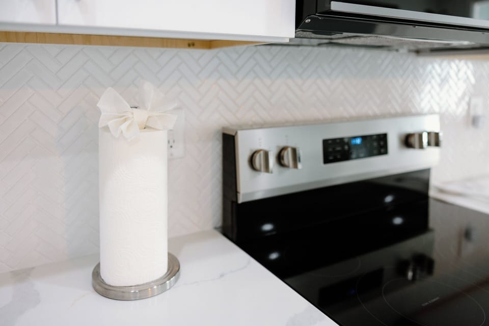 Beautifully designed kitchen fully stocked with cookware, spices, and essentials for preparing meals and hosting during your stay.