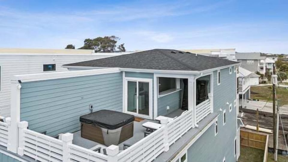 Relax and unwind in the private rooftop hot tub while enjoying elevated coastal views and the peaceful Carolina Beach atmosphere.