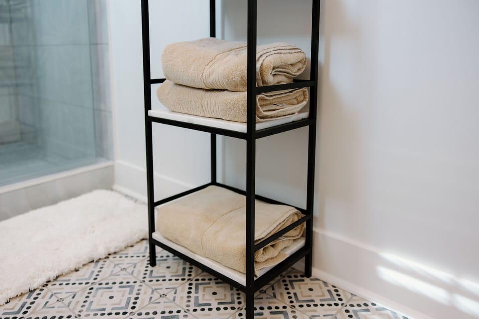 Modern en suite bathroom with walk-in shower and upscale finishes designed for comfort and convenience.
