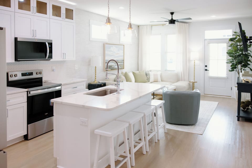 Open kitchen and dining layout provides ample space for entertaining, casual breakfasts, and family dinners.
