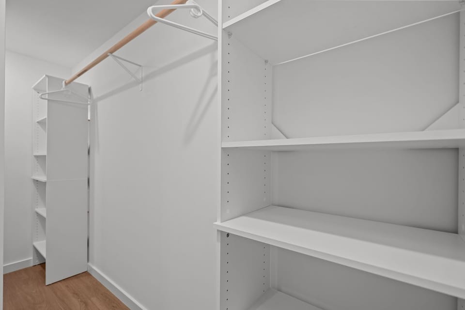 Generous walk-in closet in the primary suite offers plenty of storage for longer stays in Wilmington