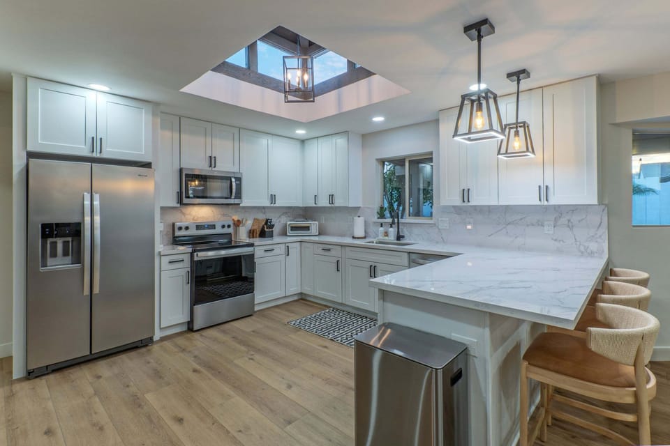 Kitchen is bright with natural light and designed to accommodate several chefs.