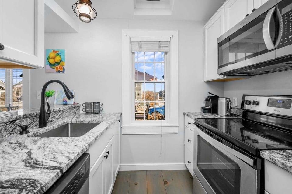 Charming Kitchen – Compact and inviting, with modern appliances