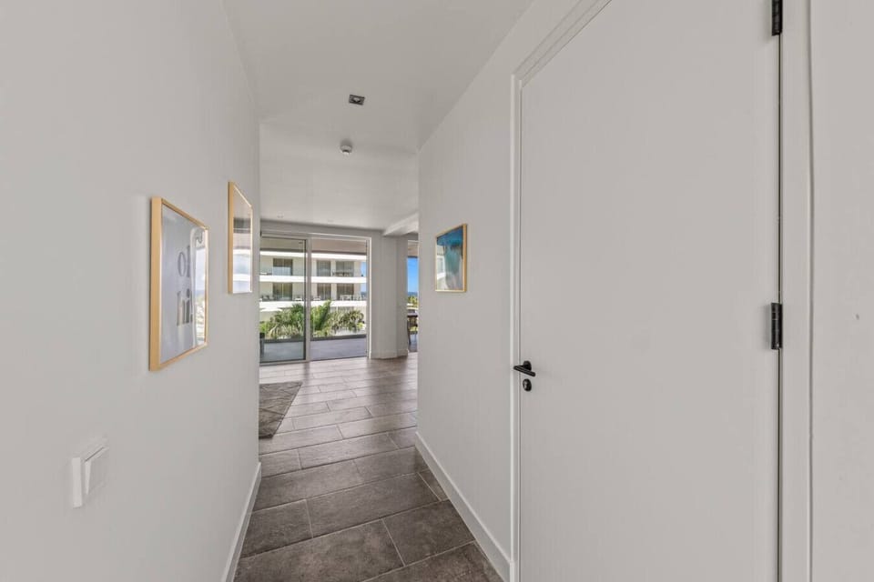 Sleek hallway with clean lines and natural light—creating a calm, elegant transition through the home.