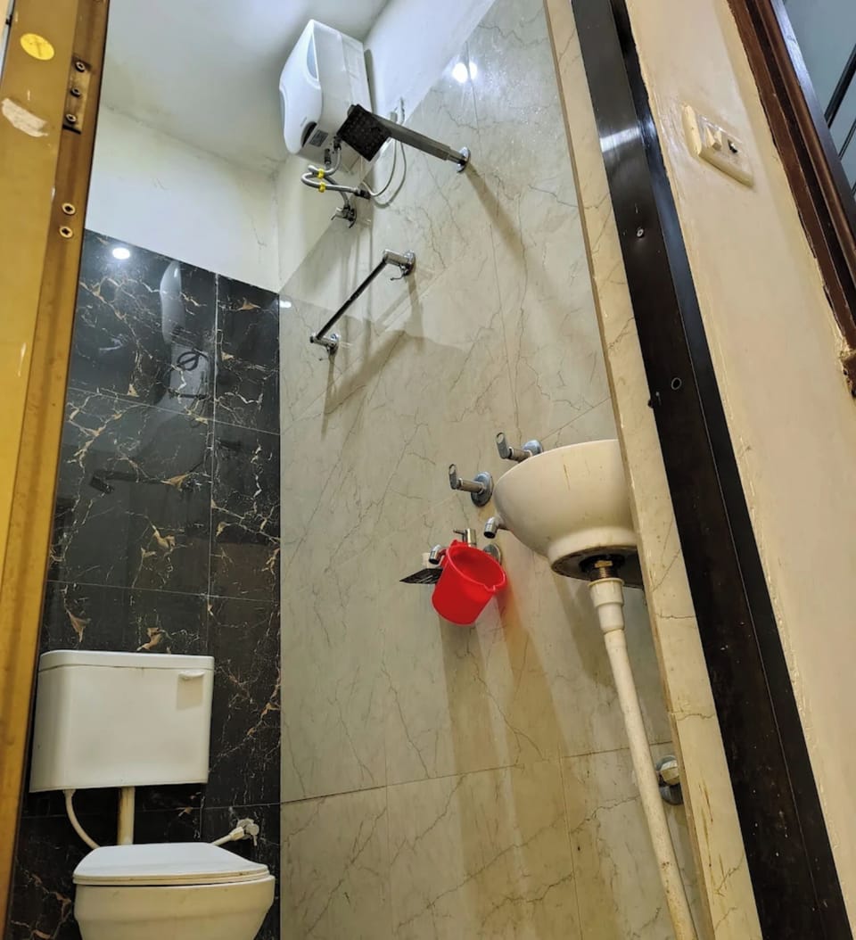 Shower, rainfall showerhead, slippers, towels