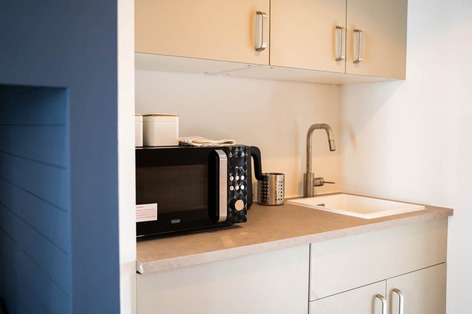 Compact kitchen with microwave, kettle and sink
